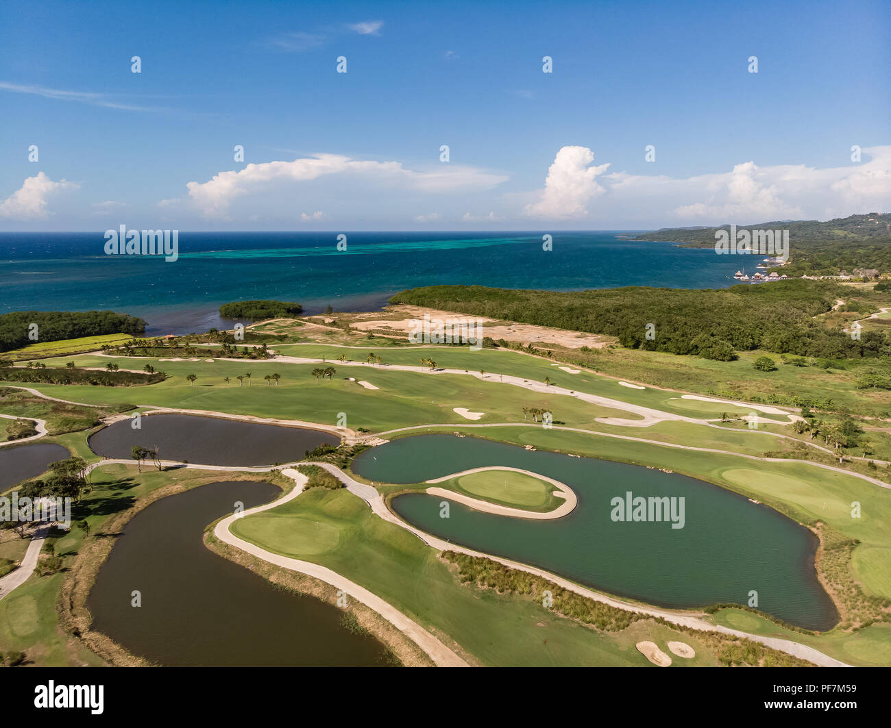 Aerial View of Tropical Golf Course with Ocean Background Stock Photo