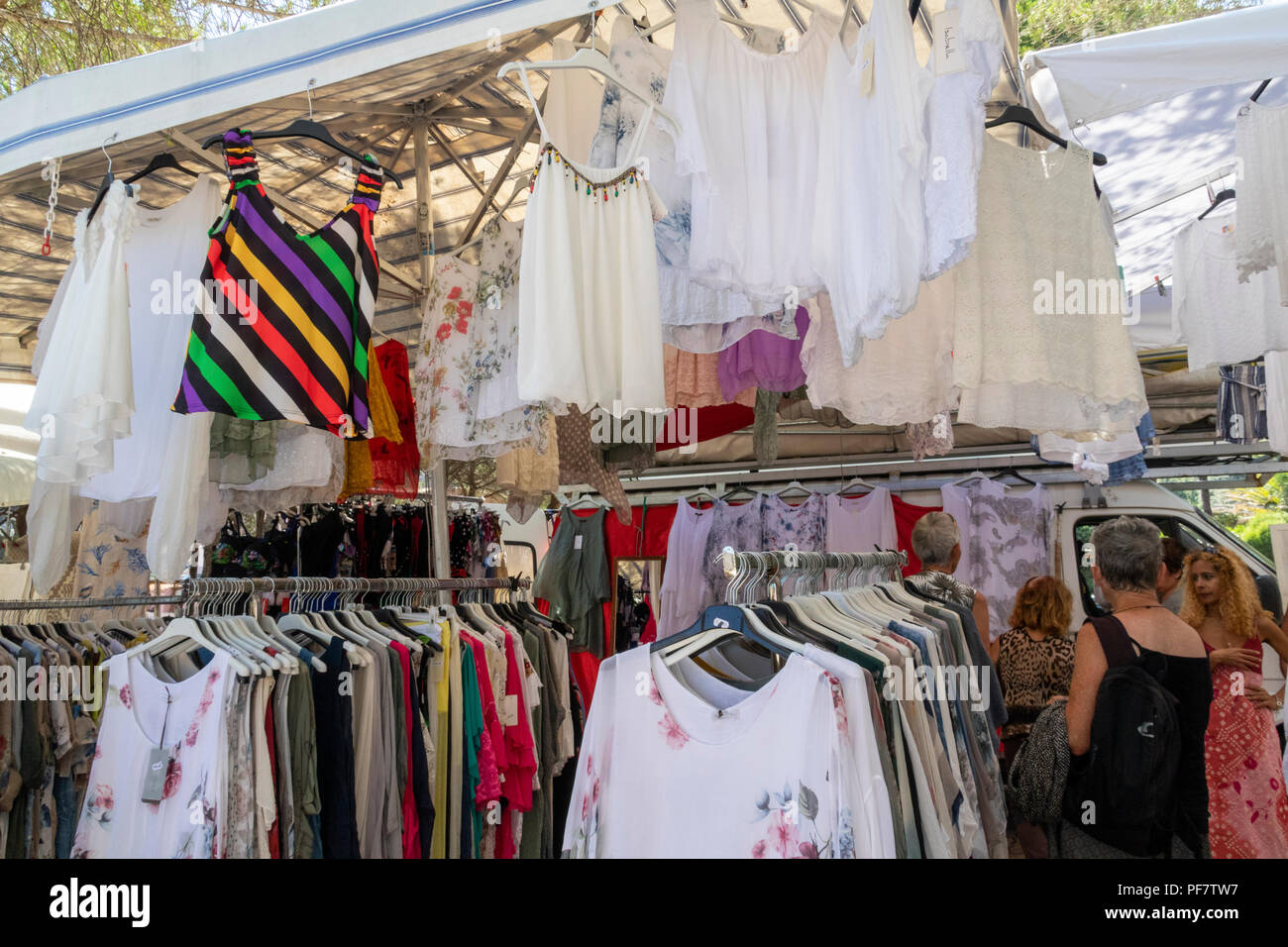 Women's Tops and Clothing for Sale at a Weekly Local Traditional Market  Stall, Baia Sardinia, Gallura, Sardinia, Italy Stock Photo - Alamy