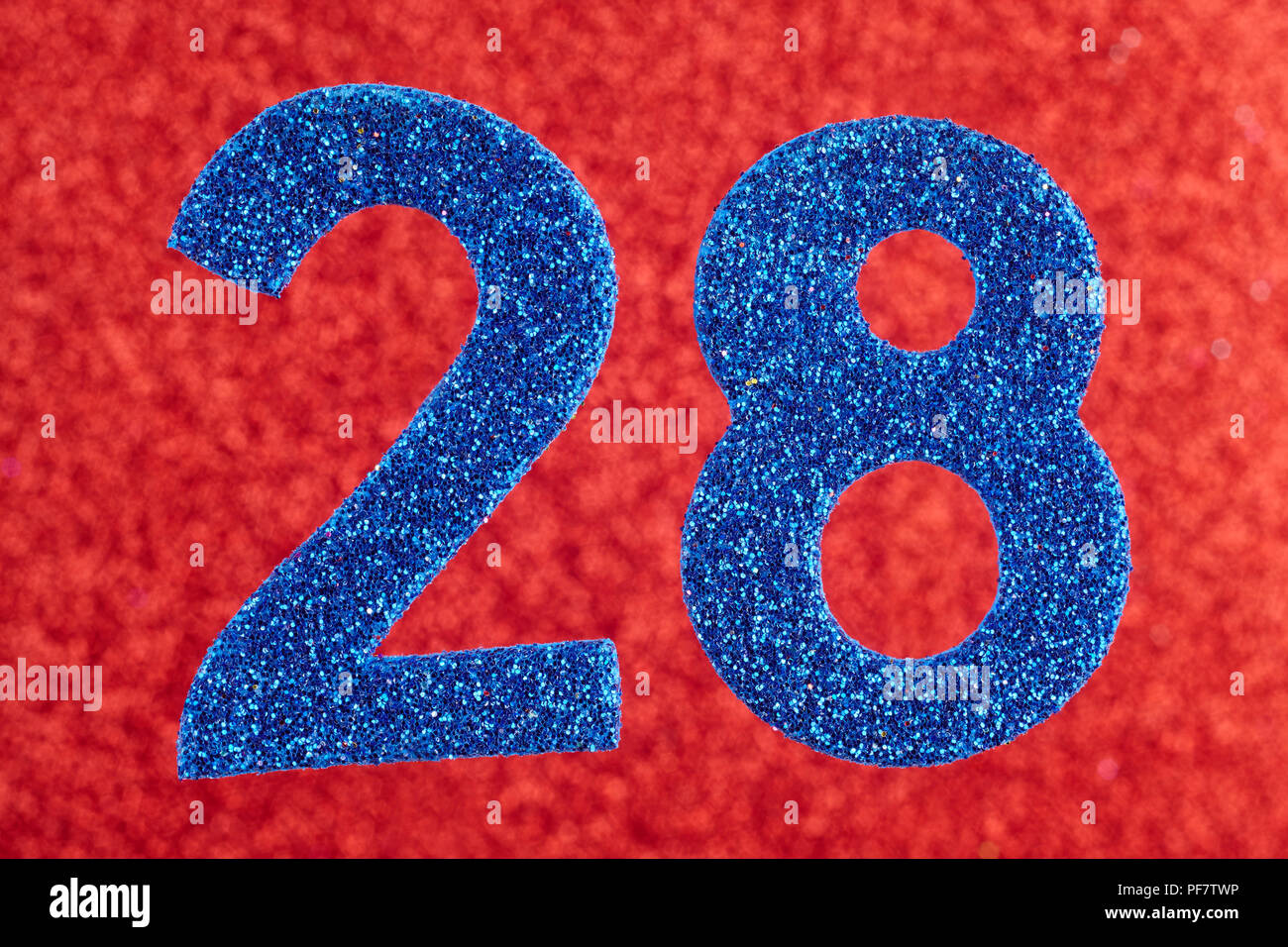Number twenty-eight blue color over a red background. Anniversary ...