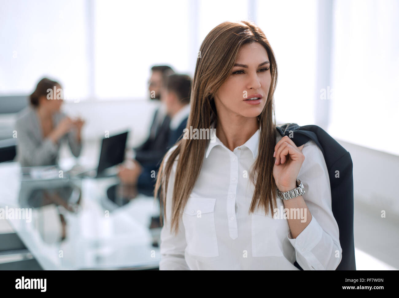 successful business woman on the background of the office Stock Photo ...