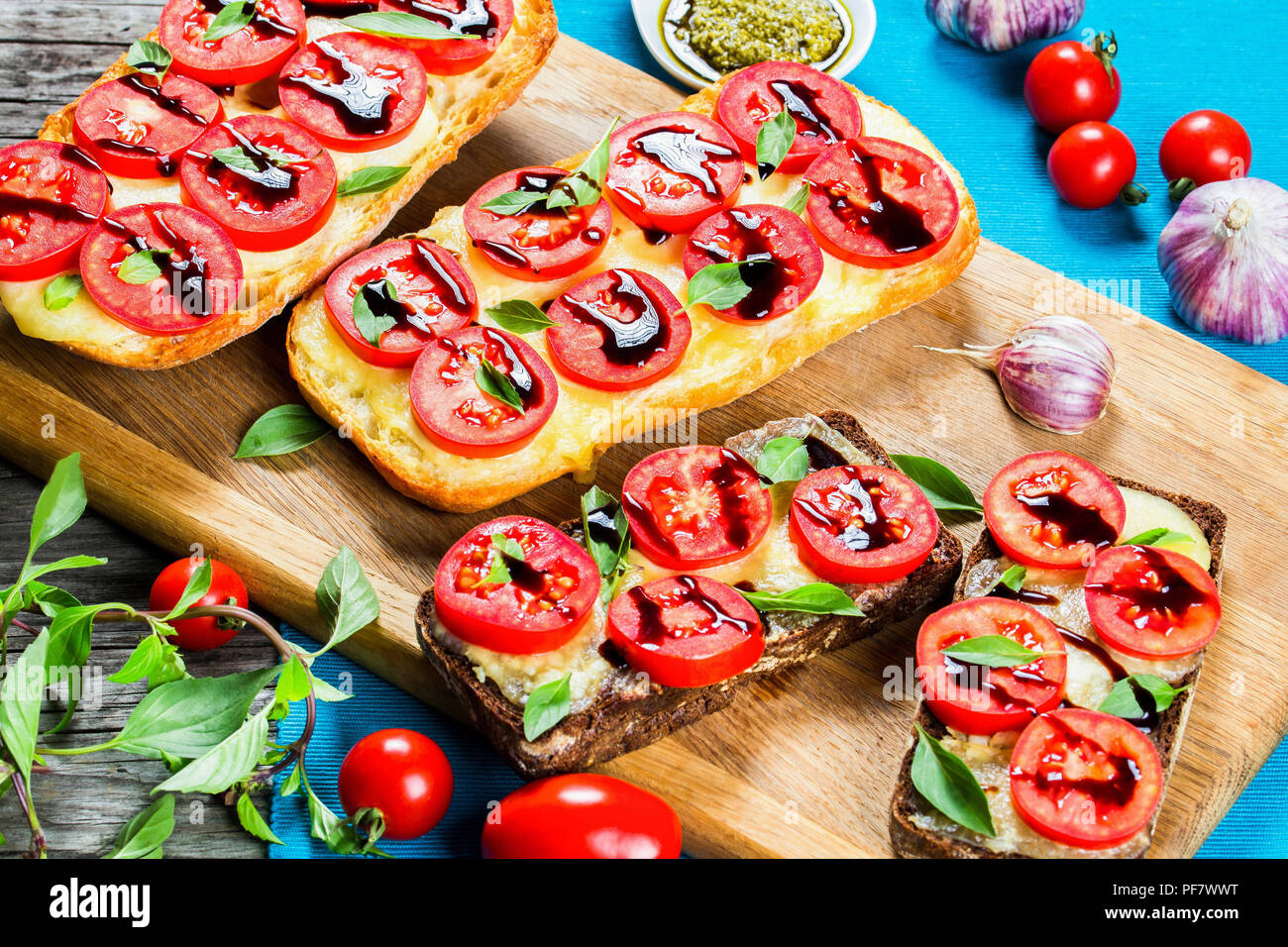 Caprese Garlic Ciabatta hot Bread toasts with mozzarella cheese, tomatoes Stock Photo Alamy
