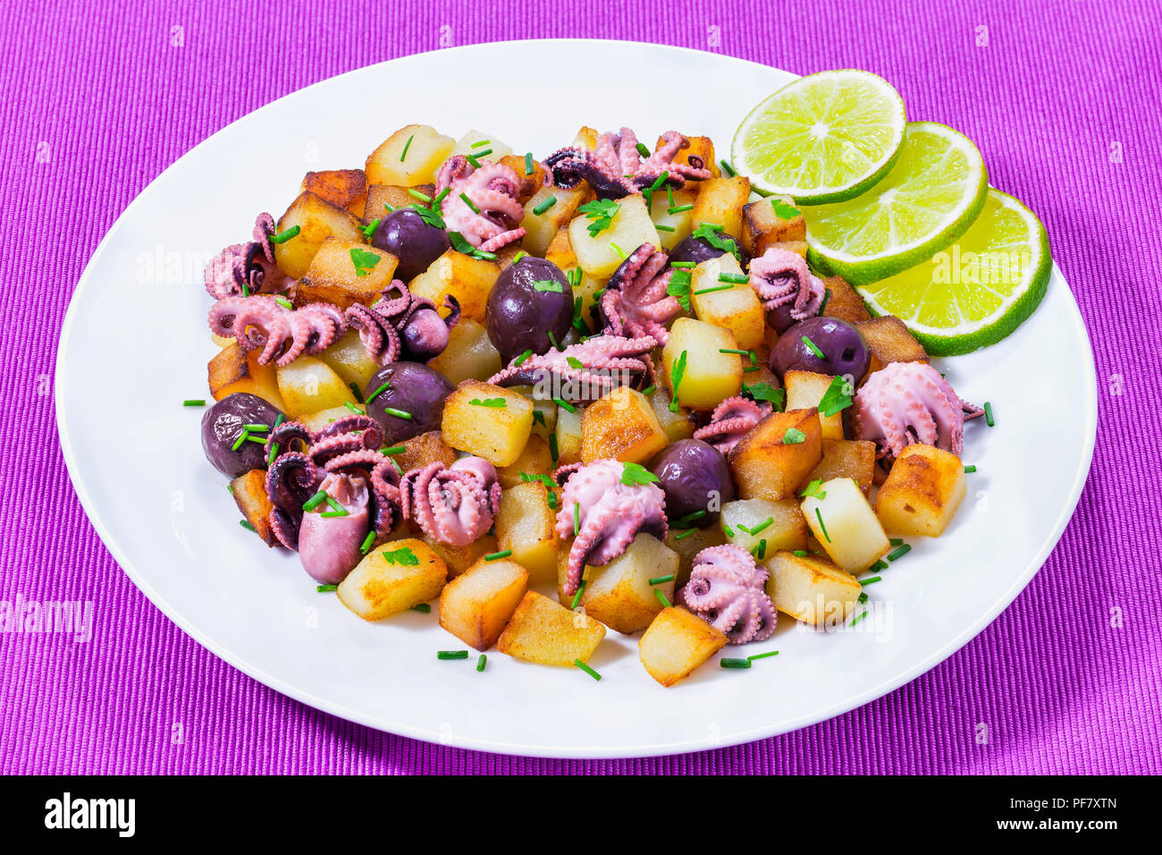 Potato salad with pickled octopus, close-up Stock Photo