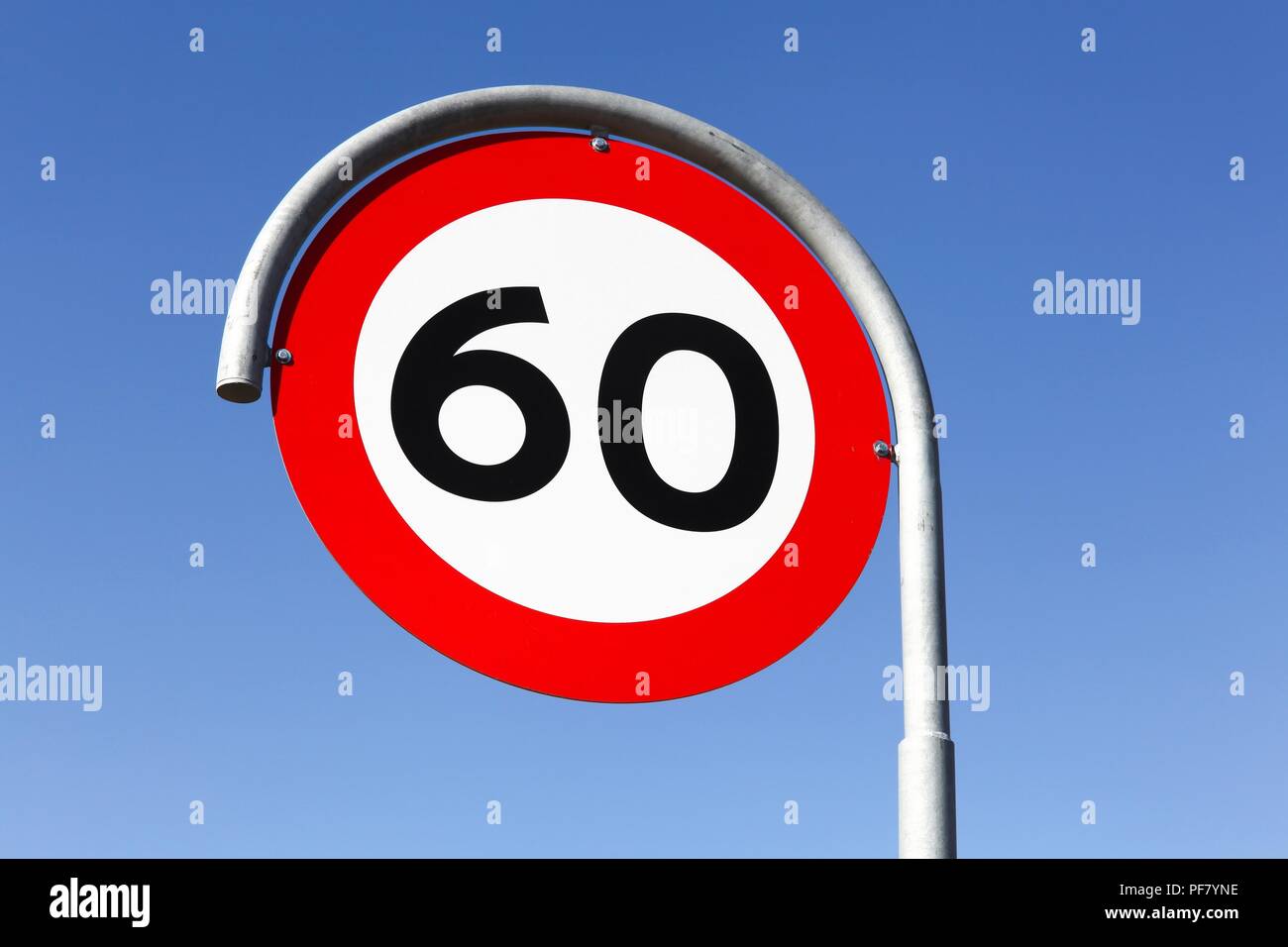 Speed limit traffic sign 60 on the road Stock Photo