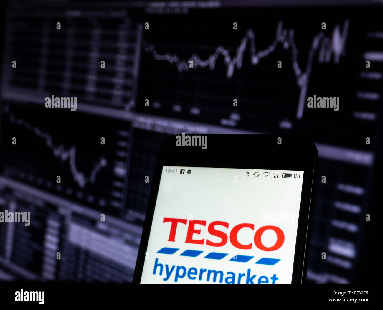 Tesco company logo seen displayed on a smart phone Stock Photo Alamy