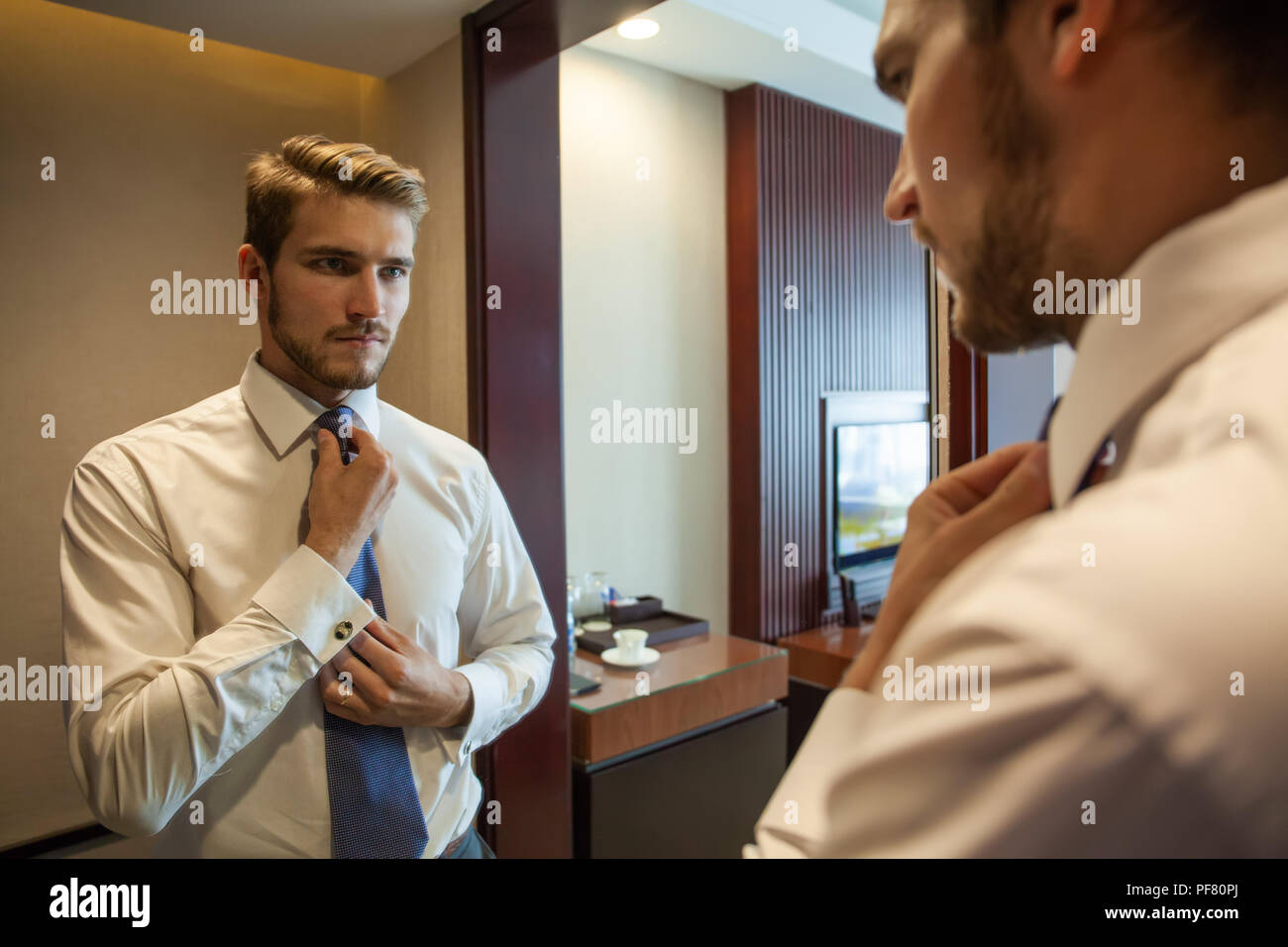 People Business Fashion And Clothing Concept Close Up Of Man In Shirt Dressing Up And Adjusting Tie On Neck At Home Stock Photo Alamy