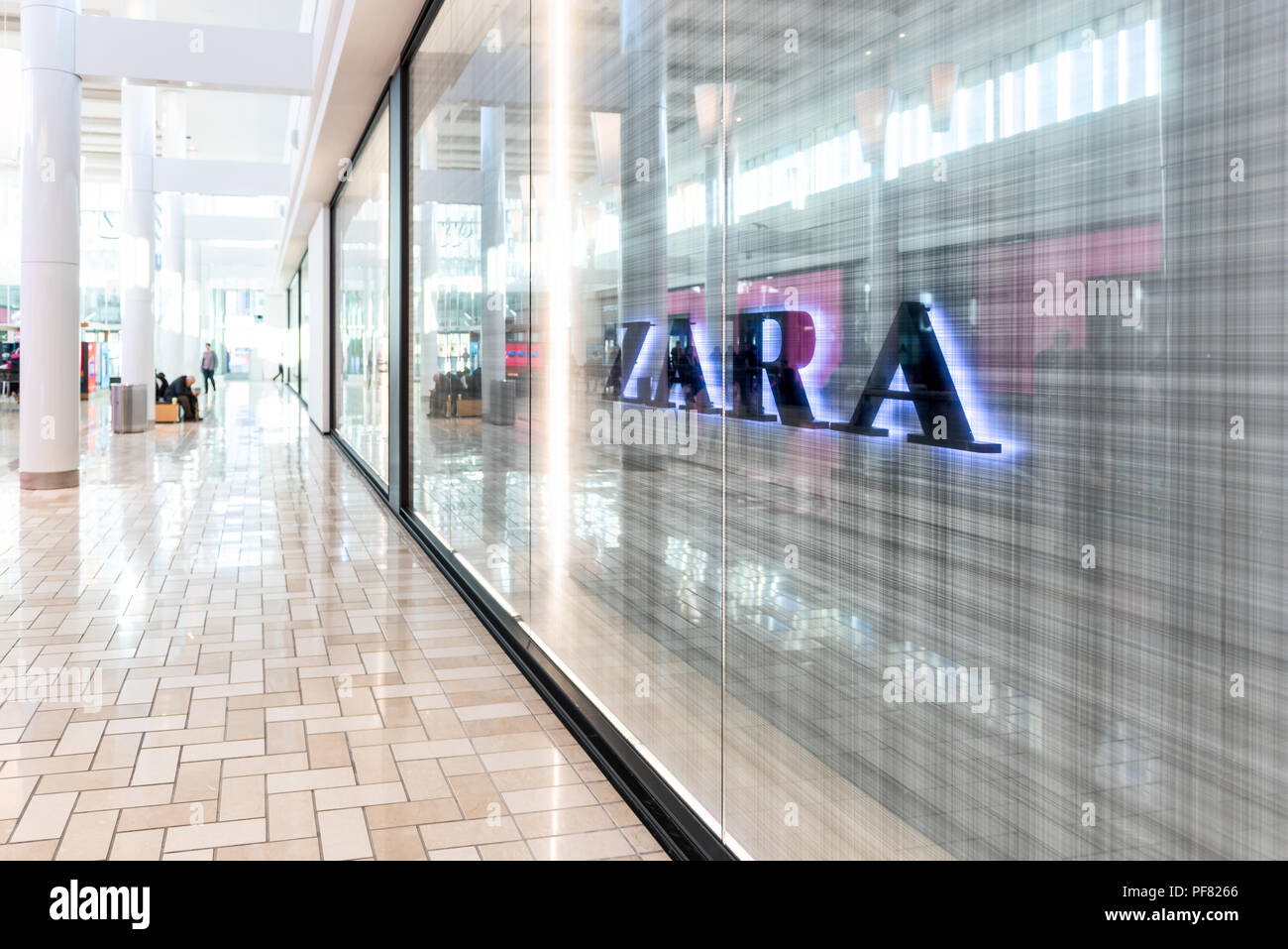 Tysons Corner, USA - January 26, 2018: Fast fashion clothing, clothes,  apparel specialty store, shop Zara with sign, logo with people walking in  shopp Stock Photo - Alamy