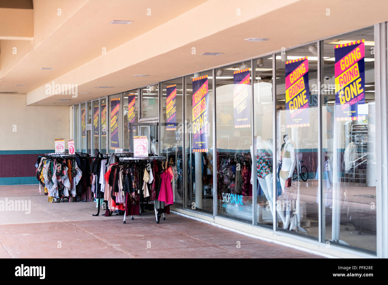 Key West, USA - May 1, 2018: Rainbow Shops specialty store, storefront in outdoor shopping mall selling discount clothing, clothes, apparel at sale, p Stock Photo