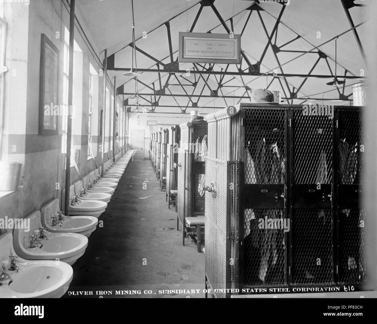Toilet facilities and employee lockers at the Oliver Mining Company facility at the Sibley Mine, Ely, Minnesota, 1915. Image courtesy Centers for Disease Control (CDC) / Minnesota Department of Health, R.N. Barr Library, Librarians Melissa Rethlefsen and Marie Jones. () Stock Photo