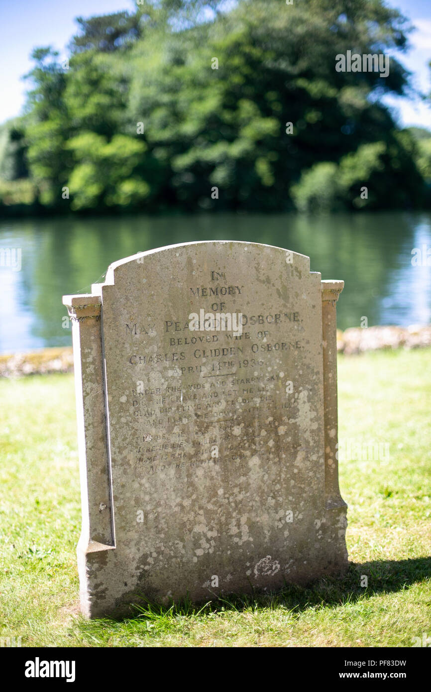 Gravestone in an English churchyard on a sunny day Stock Photo