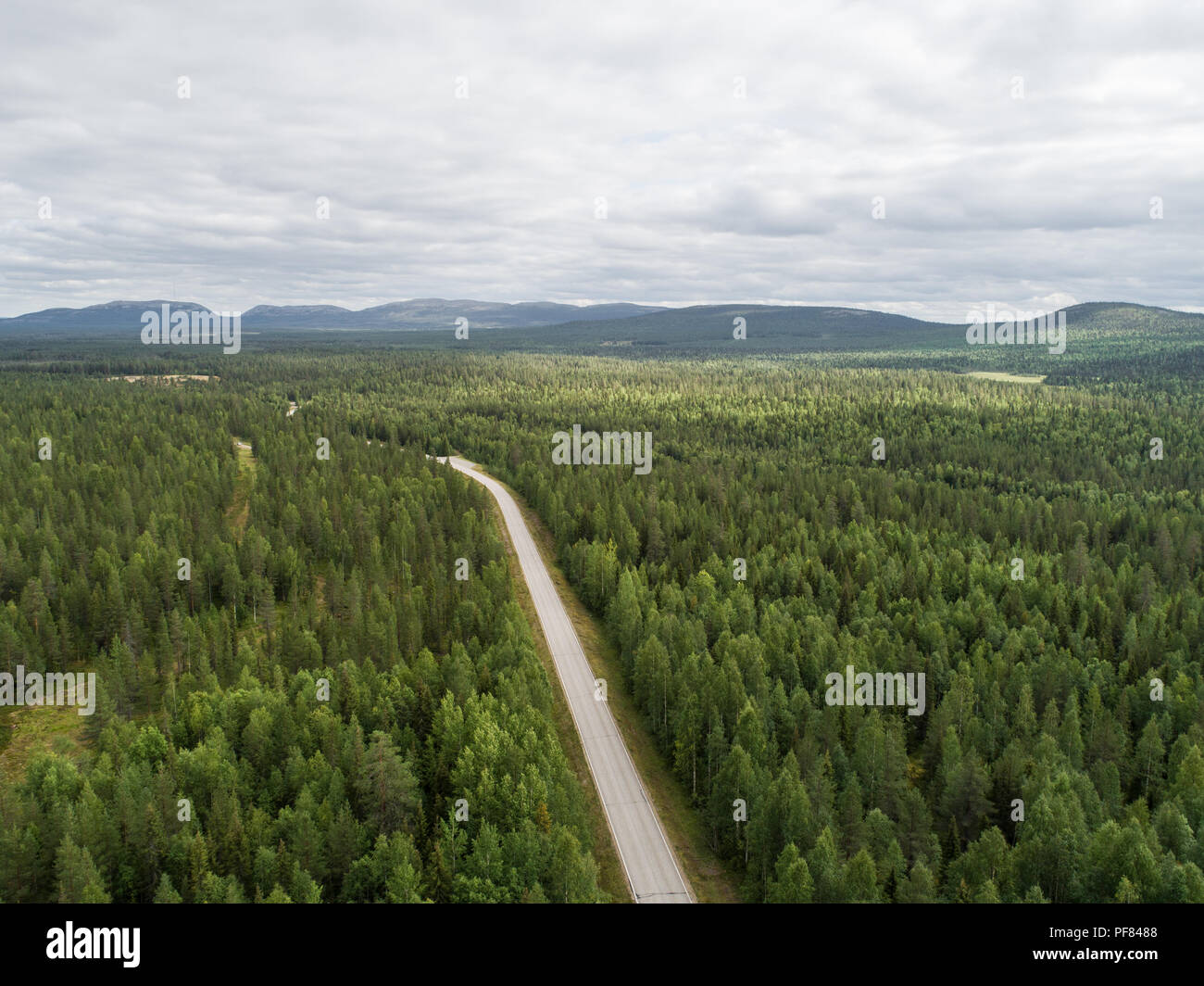 Aerial view of a forest and a road leading towards pyhä-luosto fells in Finland Stock Photo