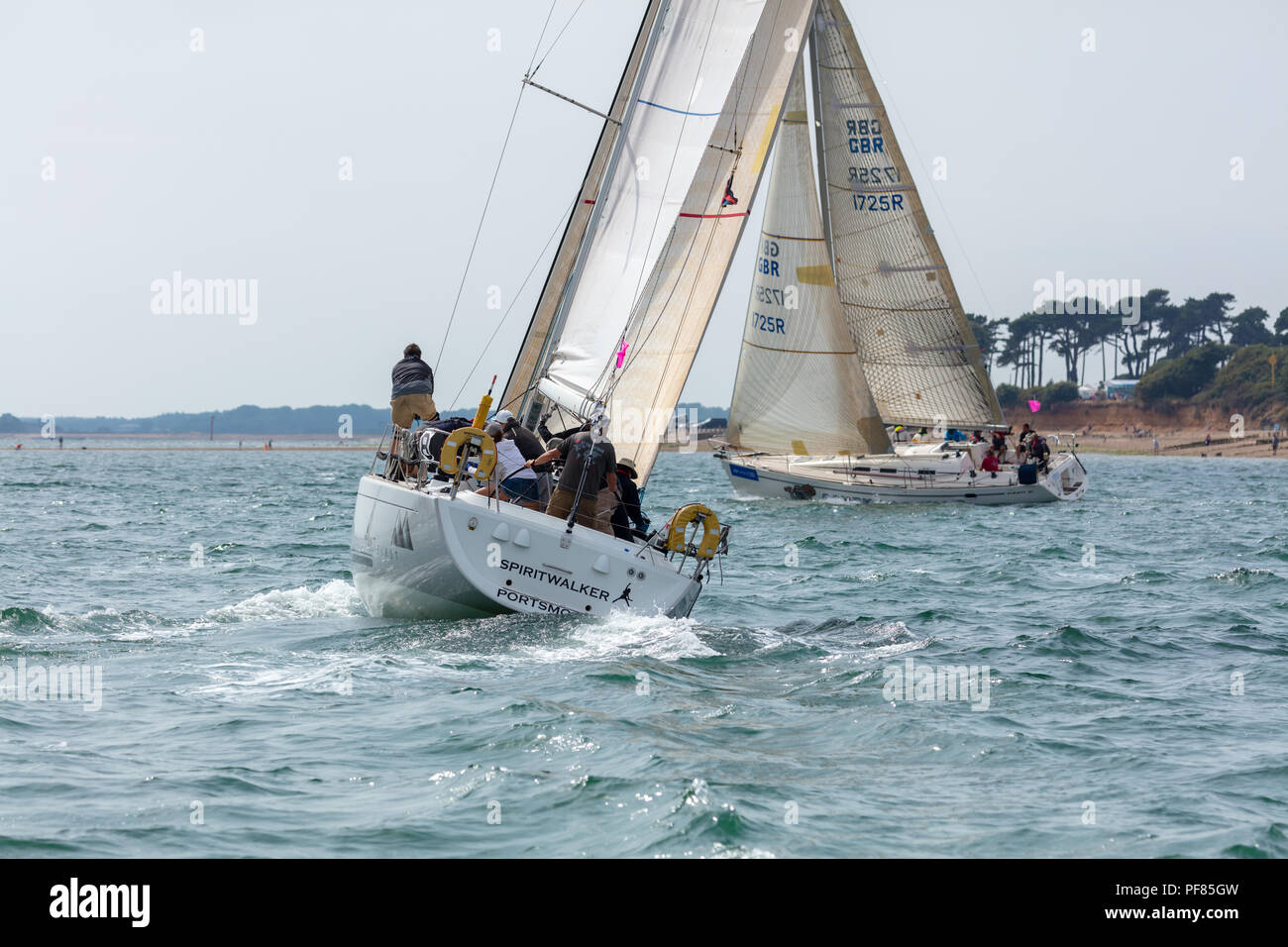 The Solent, Hampshire, UK; 7th August 2018; Two Yachts Race Close to the Shore During the Cowes Week Regatta Stock Photo