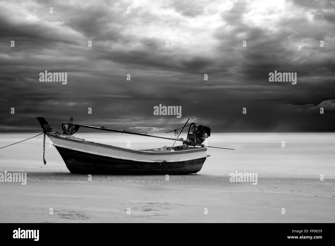 Fishing boat on the shore in black and white Stock Photo - Alamy