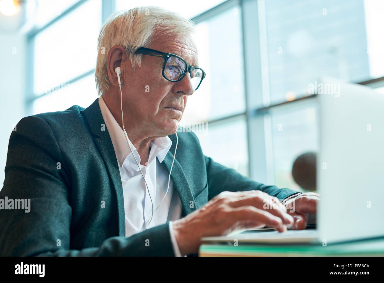 Modern Senior  Businessman Using Laptop Stock Photo
