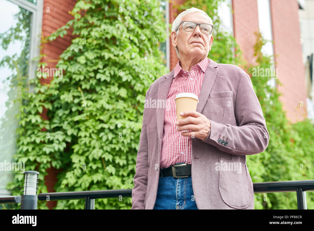Modern Senior  Man Posing Outdoors Stock Photo