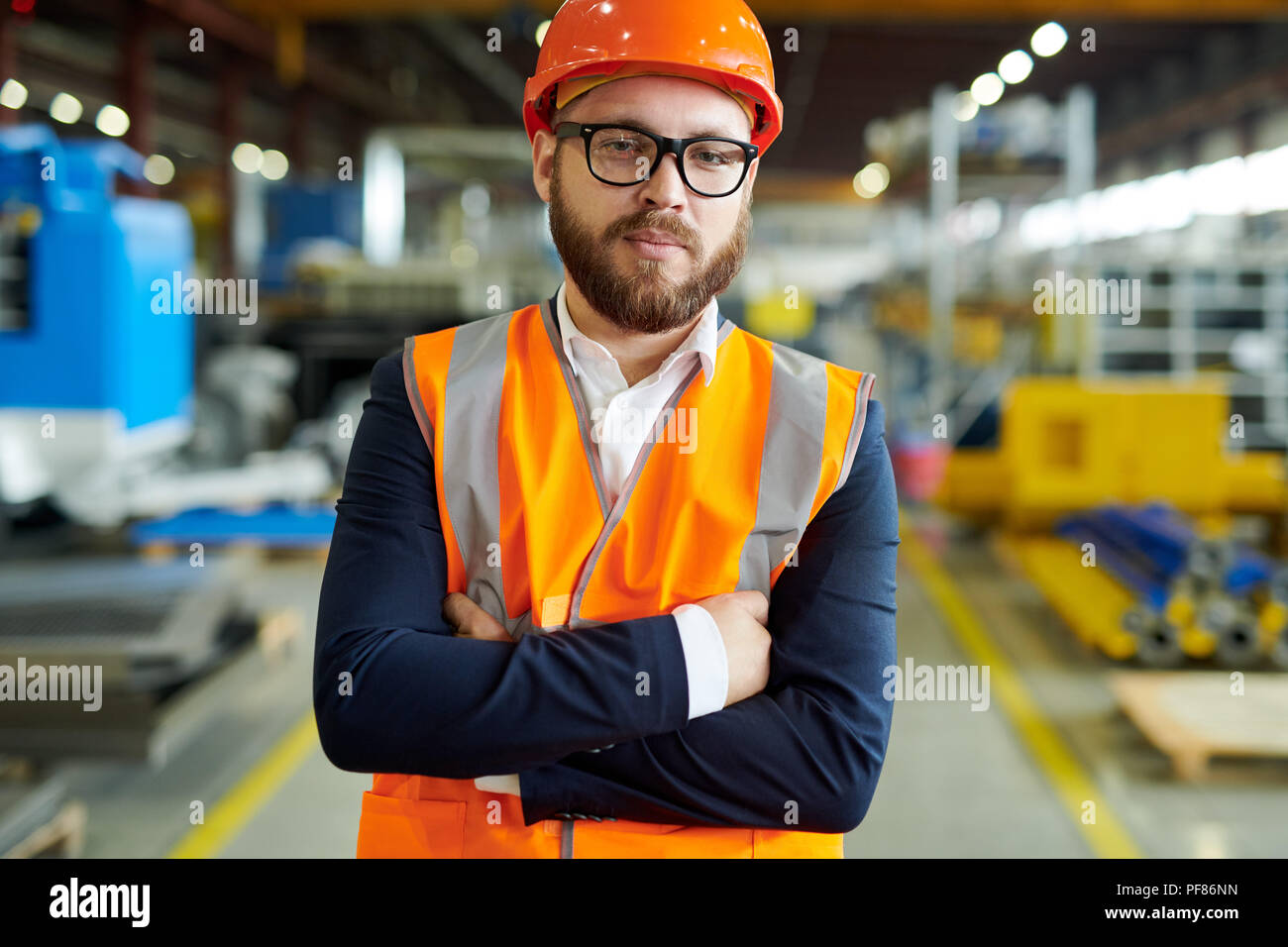 Bearded Businessman Wearing Hardhat Stock Photo