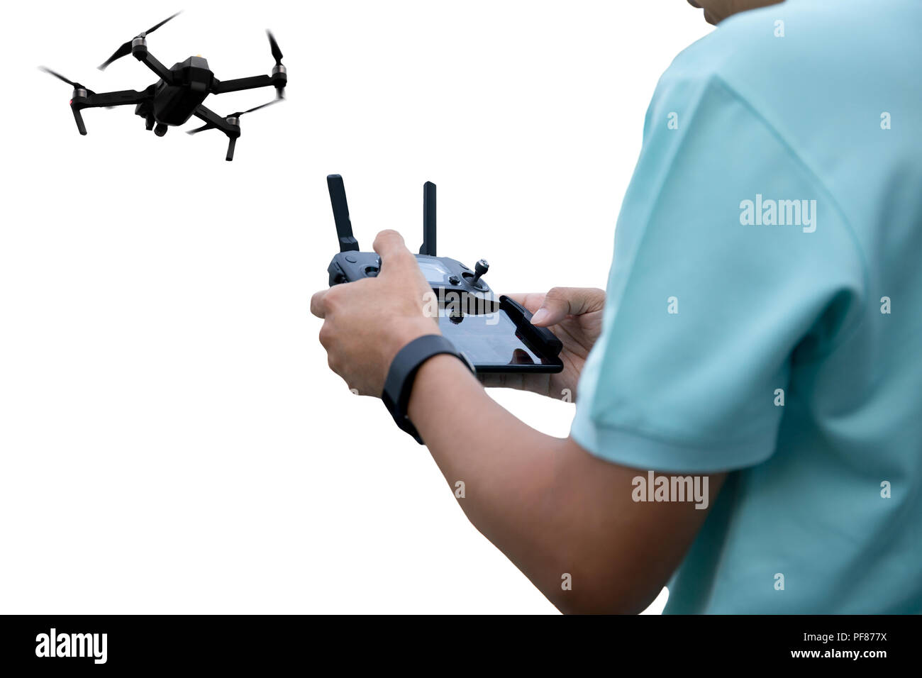 Hands of a man with radio control drone isolated on white background Stock Photo