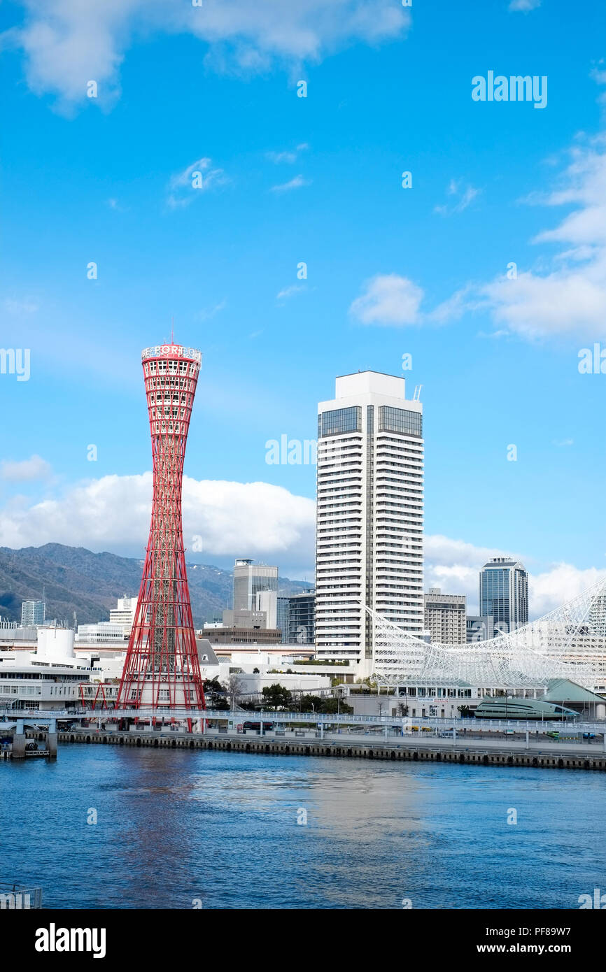 Kobe Port Tower, famous landmark under blue dramatic cloudy sky and bright sunshine in Kobe, Japan Stock Photo