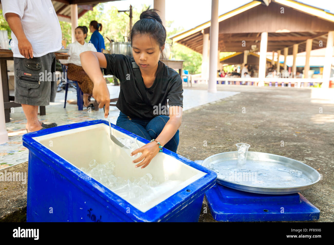 Thailand woman gathered in a Buddhist temple for a charity dinner and helping people Stock Photo
