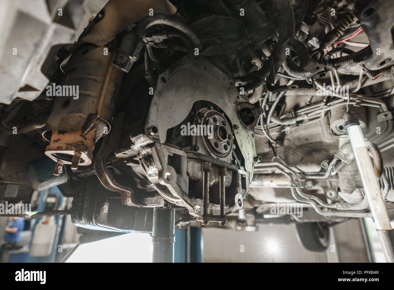 Change and repair clutch, drive axle. working underneath a lifted car