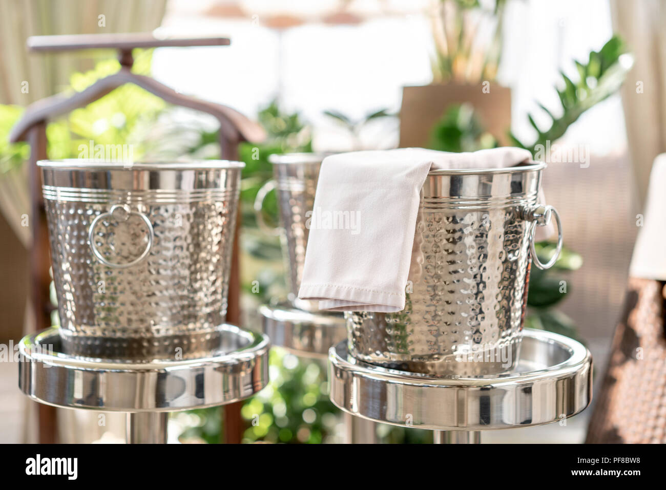 Metal buckets with an ice for cooling drinks. Service area the waiter