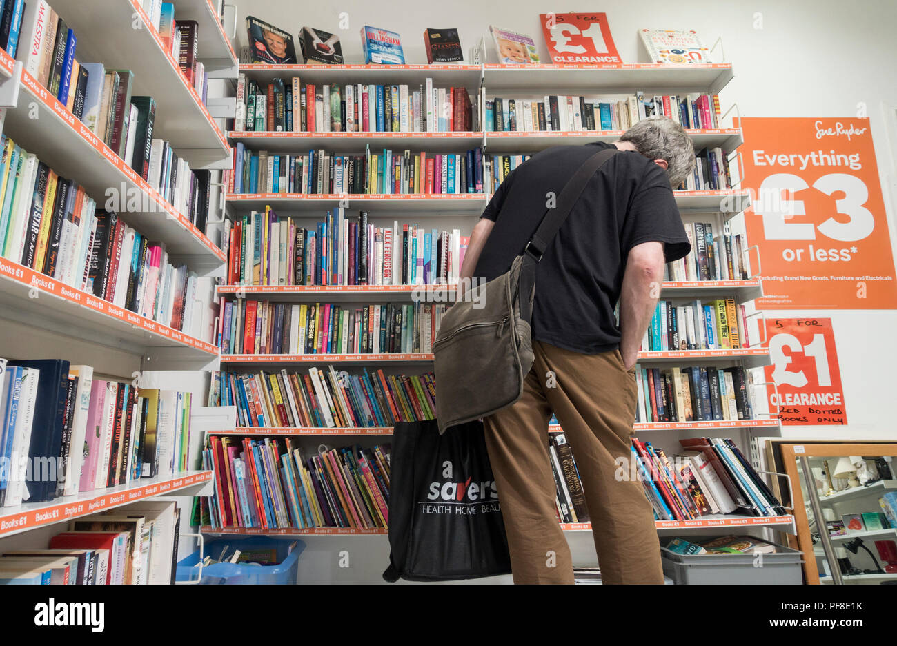 Man shopping in charity shop hires stock photography and images Alamy
