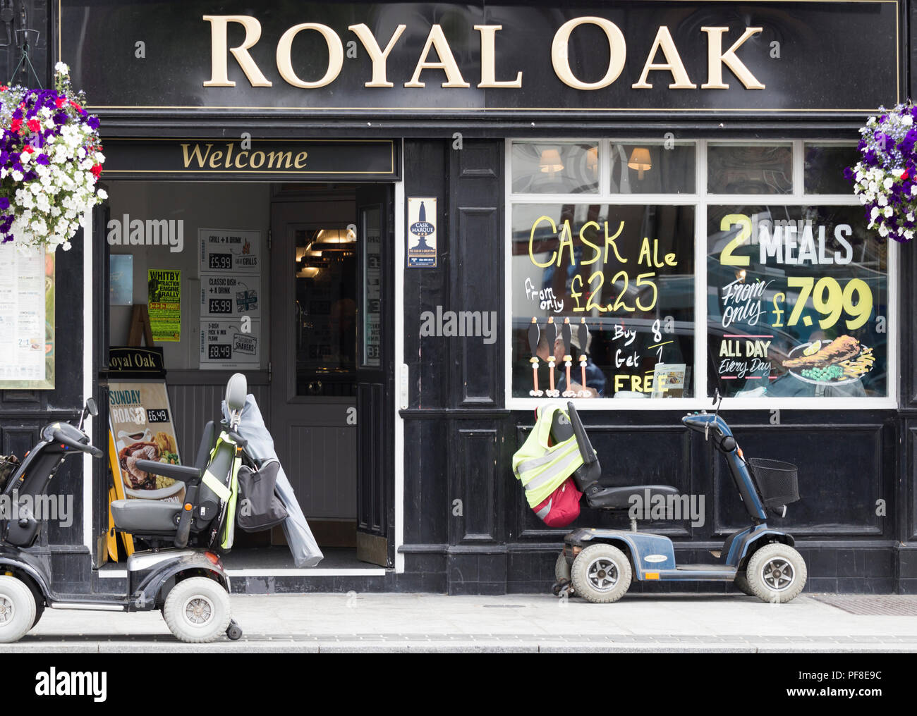 Mobility scooters outside Royal Oak pub in Stockton on Tees, north east England. UK Stock Photo