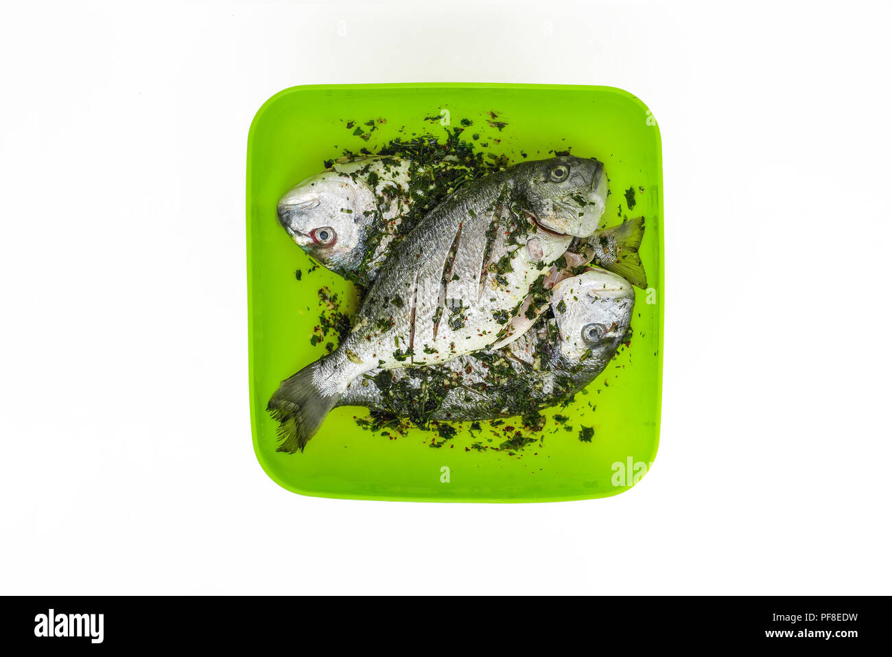 Marinated raw fish ready to be cooked Stock Photo Alamy