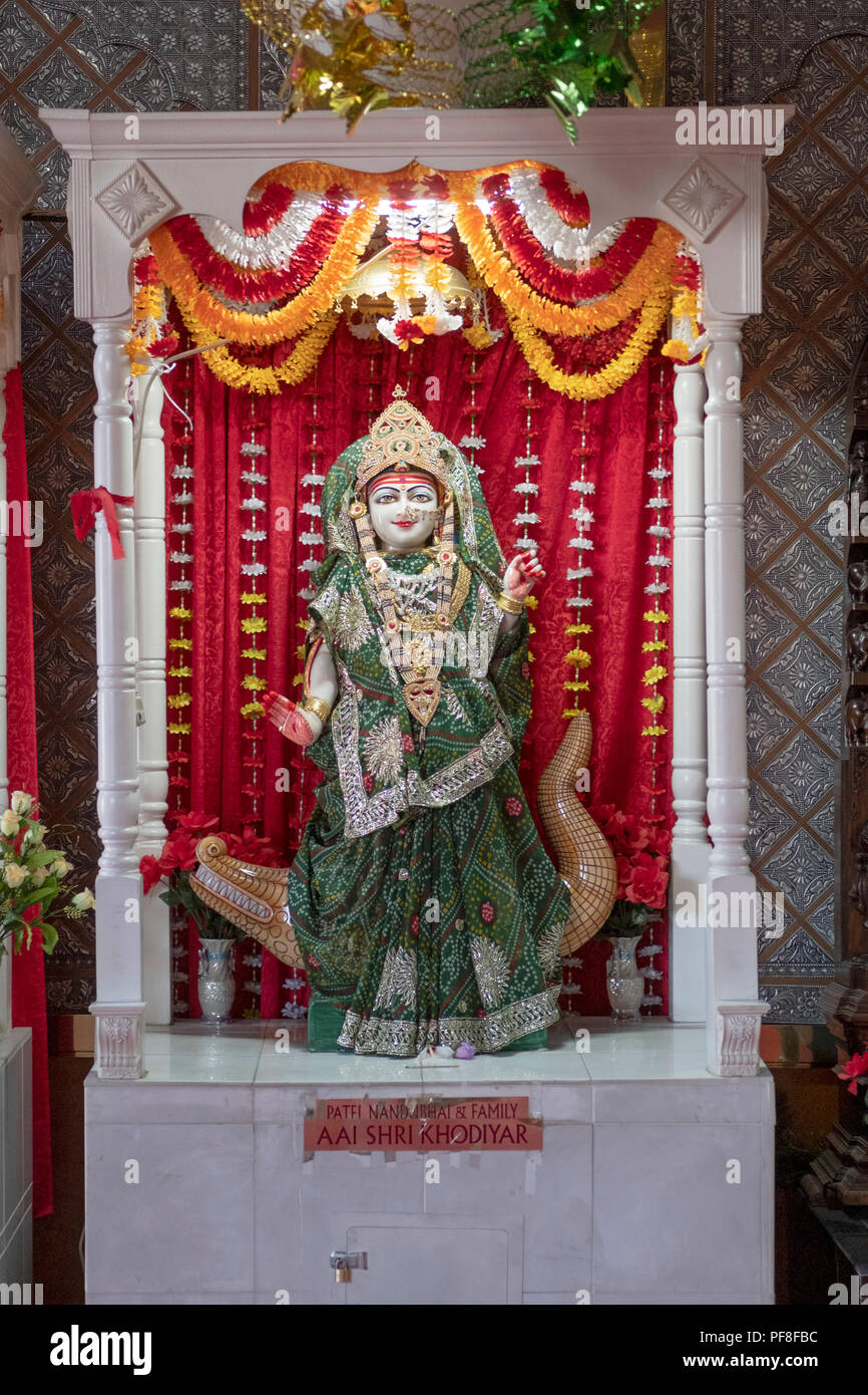 A statue of the Hindu warrior goddess Shri Khodiyar  inside a temple in Woodside, Queens, New York City. Stock Photo