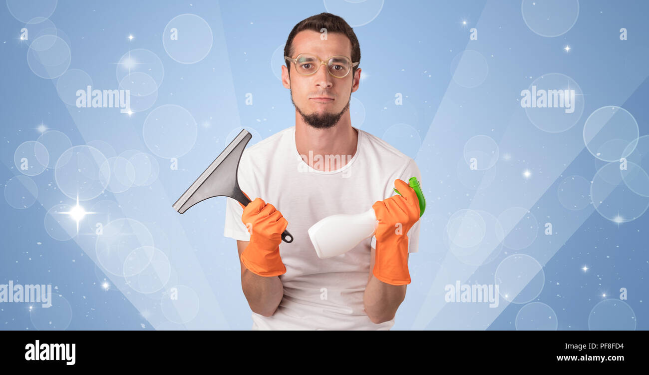 Glittered Blue Background With Male Housekeeper And Cleaning Equipment Stock Photo Alamy