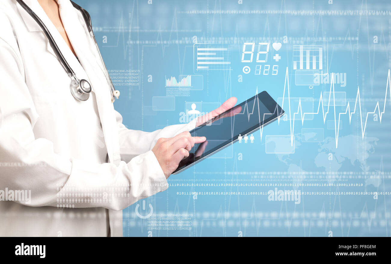 Female doctor holding tablet with blue background and heart related ...