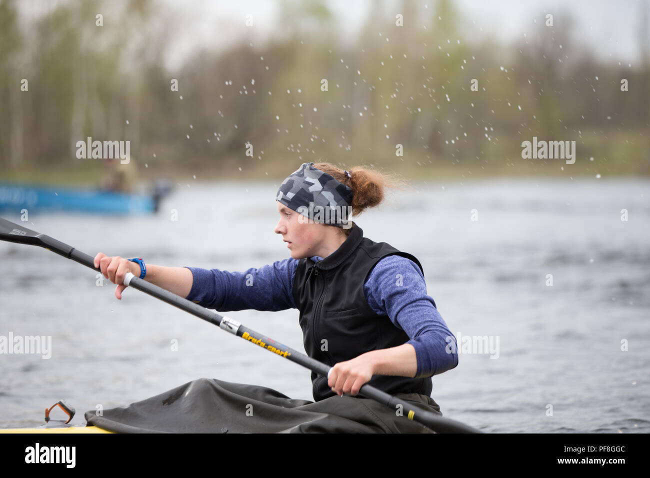 Belarus, Gomel, 25 April 2018. Training in rowing. Female athlete engaged in rowing.Girl in a sports boat with oars Stock Photo