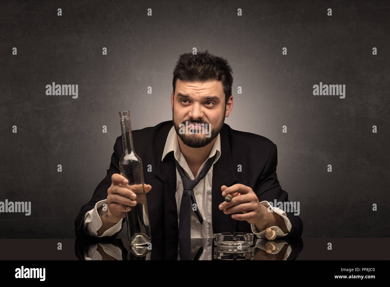 Young drunk man at his office with free dark copyspace Stock Photo - Alamy