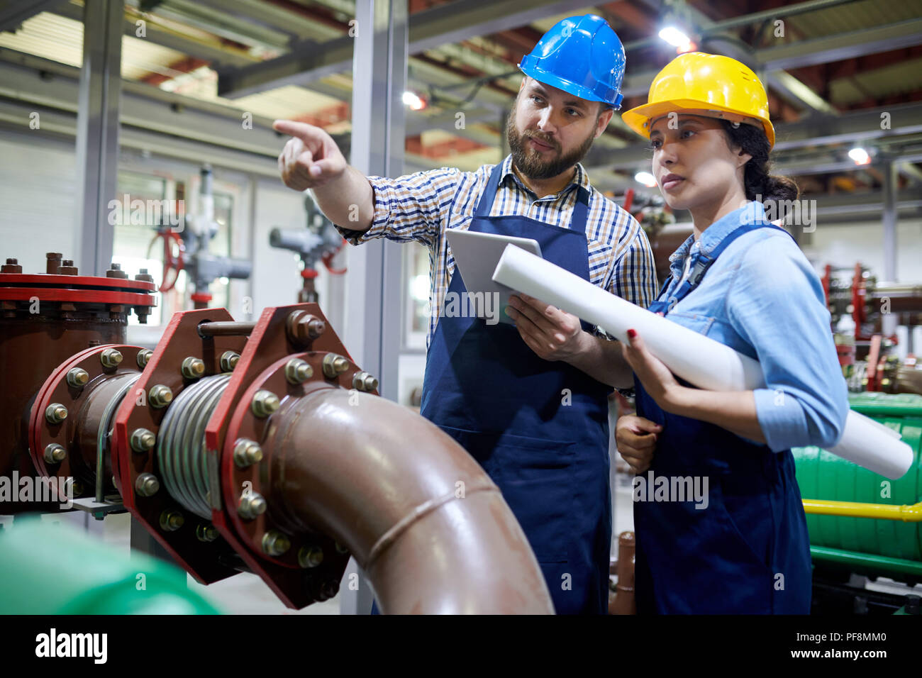 Workers in Water Purification System Stock Photo