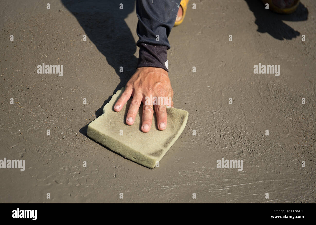 Worker Smooth Concrete Floor With Sponge Stock Photo Alamy