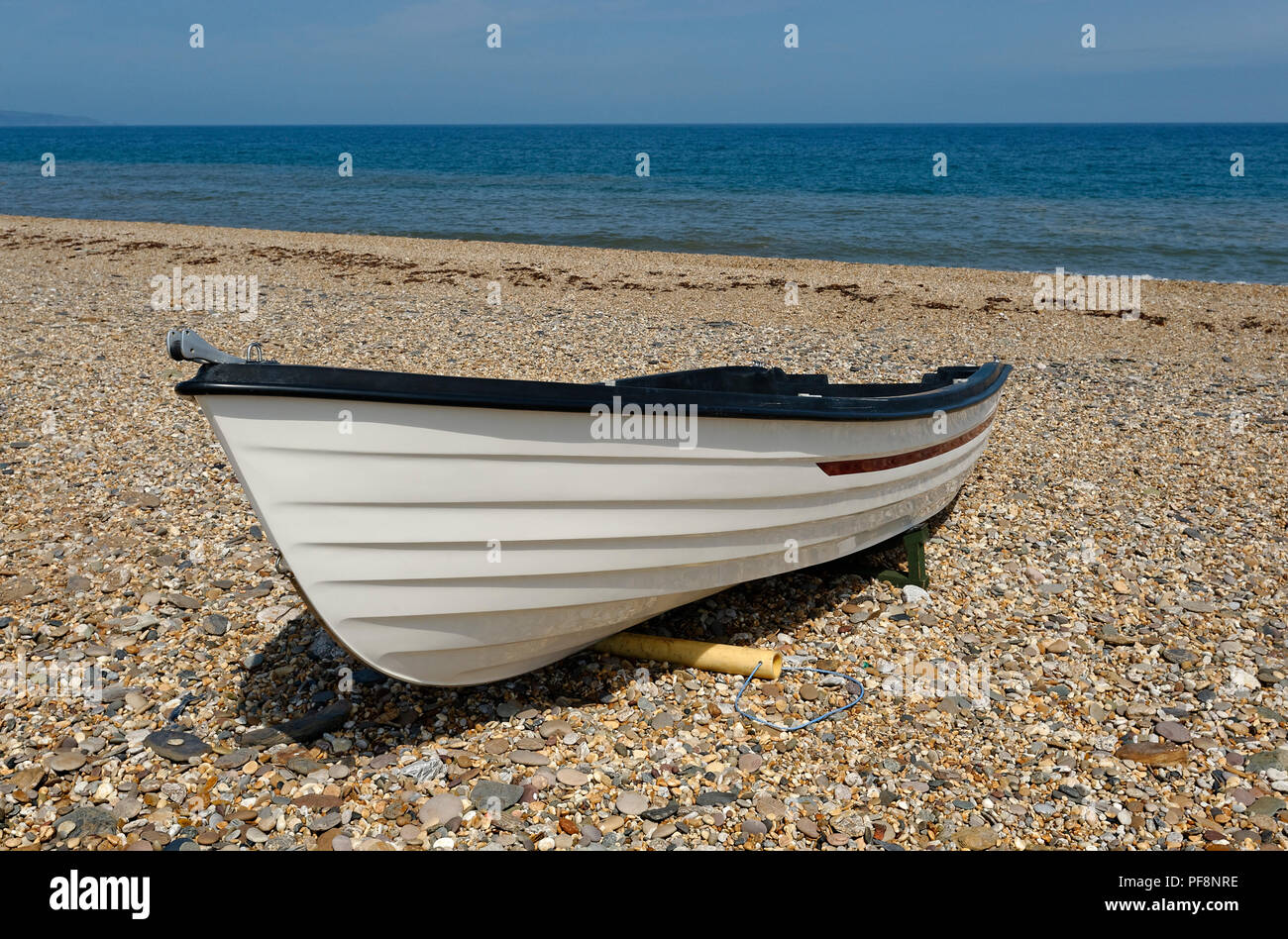 single boat on a Devon Sea shore Beesands Stock Photo