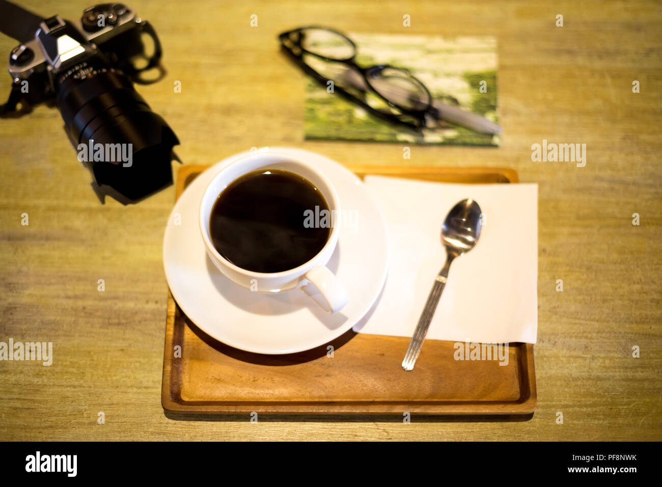 Top view with coffee cup and camera  Stock Photo