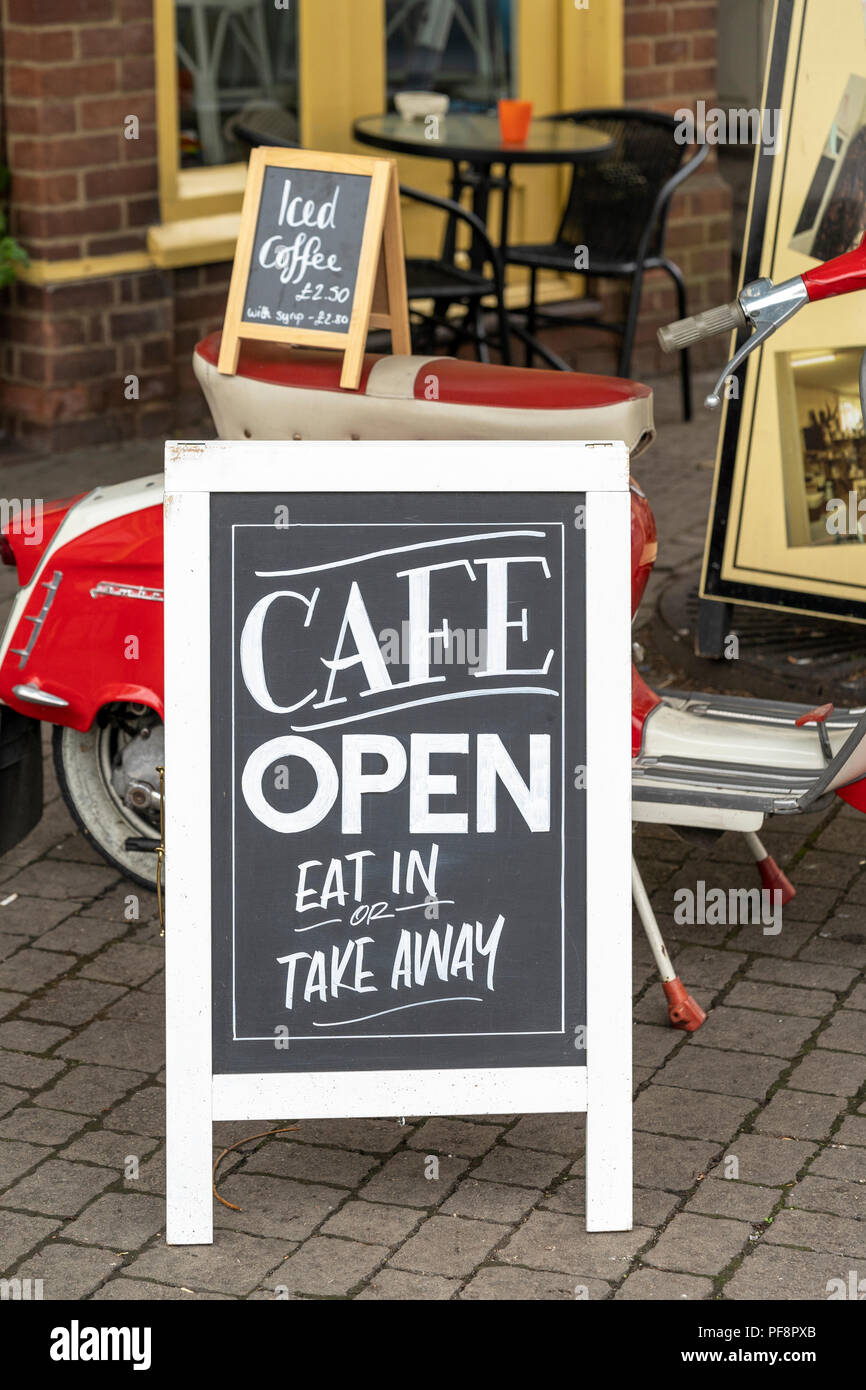 Cafe chalk board sign with Lambretta scooter Stock Photo