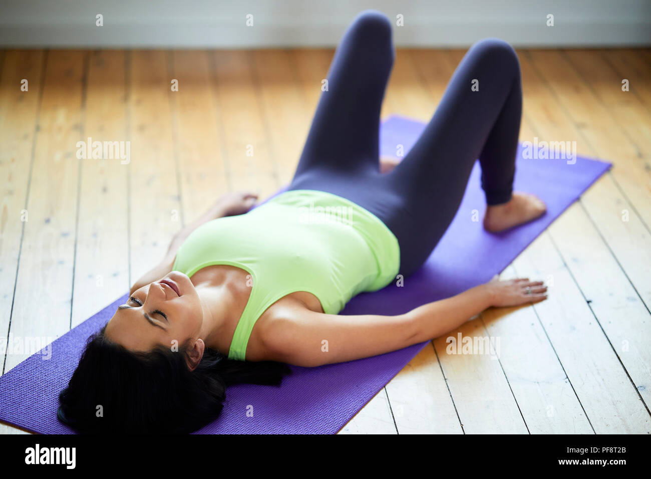 Woman practicing Yoga Stock Photo