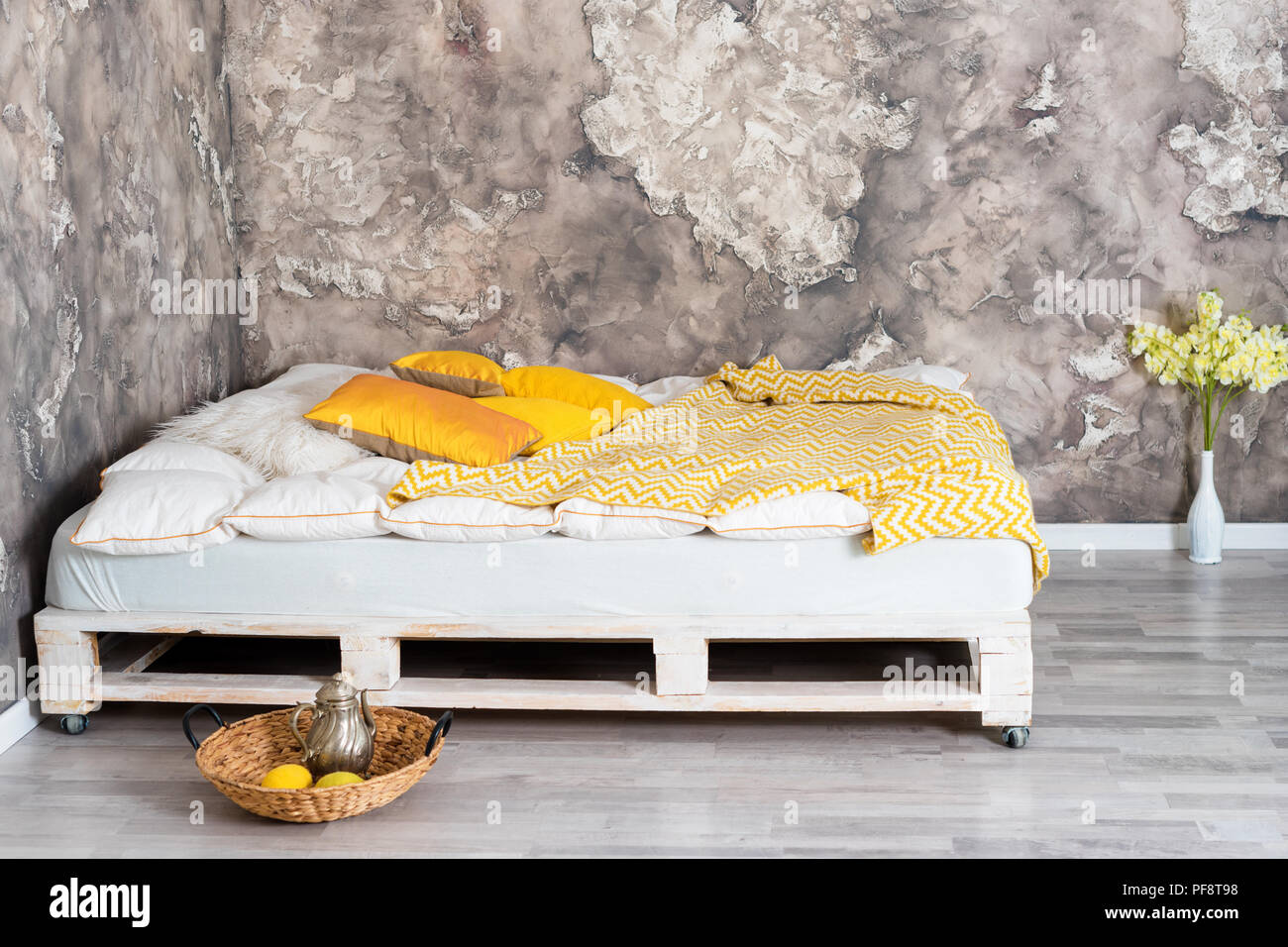 Bed made of pallets in loft interior Stock Photo Alamy