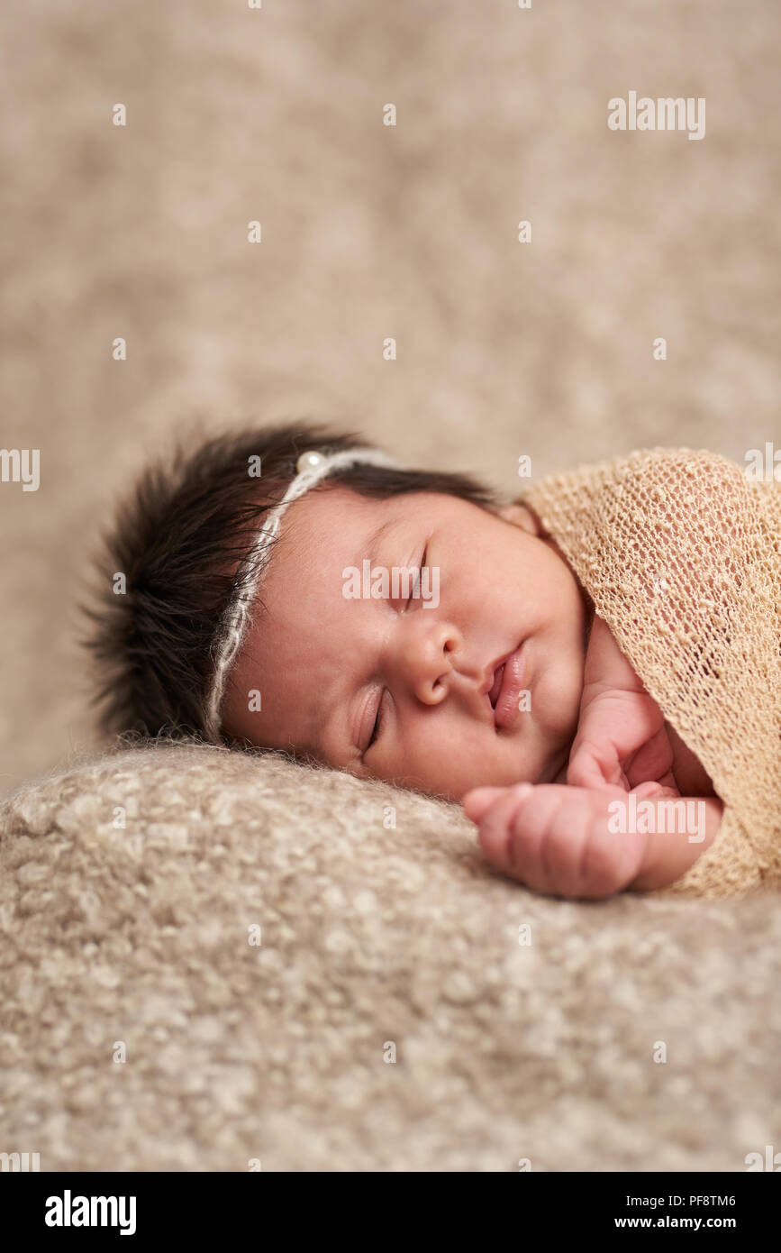 Portrait of sweet sleeping baby on soft blurred background Stock Photo