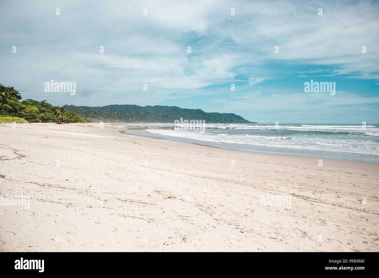 Clean sandy beach of Playa Carmen, Santa Teresa, Puntaarenas province