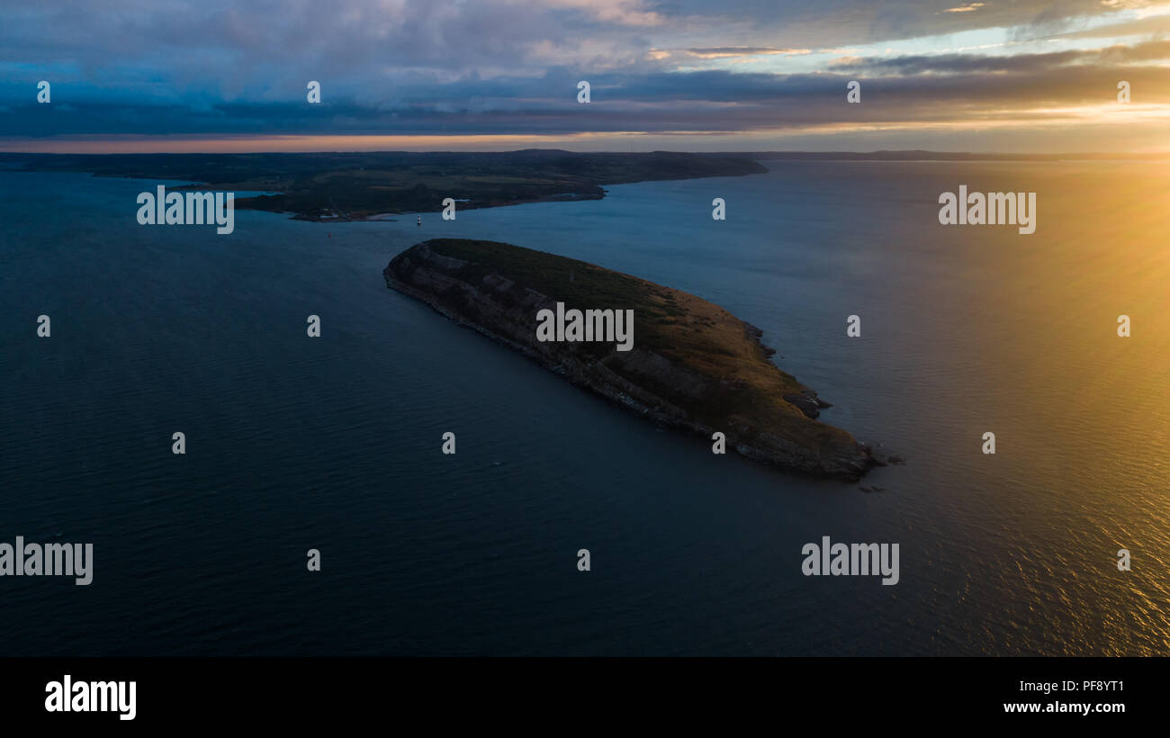 Aerial Shot of Puffin Island and Penmon Lighthouse on Anglesey, Wales, UK Stock Photo