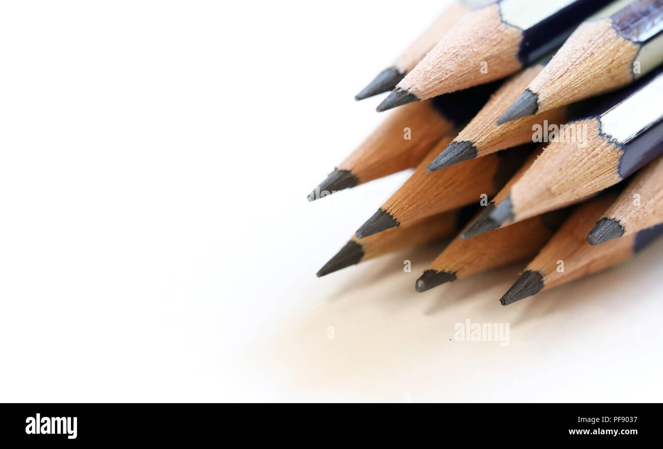 Arrangement of close up sharpened drawing writing graphite pencils. Imagine draw write think create concept or idea. Stock Photo