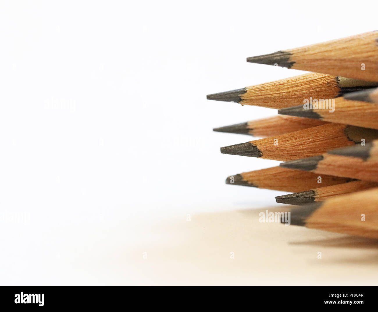 Arrangement of close up sharpened drawing writing graphite pencils. Imagine draw write think create concept or idea. Stock Photo