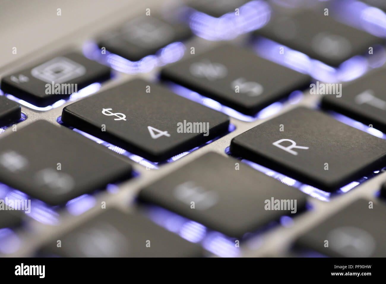close up of the $ symbol sign on a computer laptop key board. the dollar currency tab button on a keyboard Stock Photo