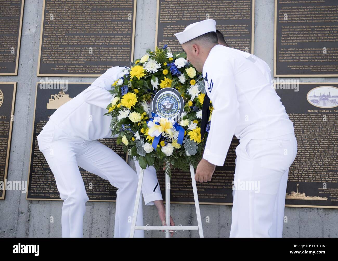 Va.  (June 6, 2018) Sailors assigned to Assault Craft Unit (ACU) 2 lay a wreath during the 74th D-Day commemoration ceremony at the National D-Day Memorial. The Memorial resides in Bedford, Va., the town that suffered the highest per-capita loss of lives in the D-Day invasion over any community in the allied forces. Stock Photo