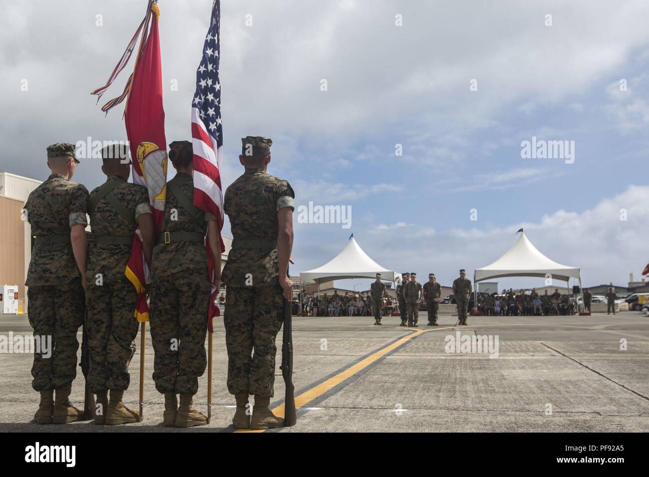 U.S. Marines with Marine Unmanned Aerial Vehicle Squadron 3 (VMU-3) salute during a change of command ceremony, Marine Corps Air Station Kaneohe Bay, Marine Corps Base Hawaii, June 7, 2018. Lt. Col. Kenneth Phelps retired and relinquished command of VMU-3 to Lt. Col. Peter Ban. Stock Photo