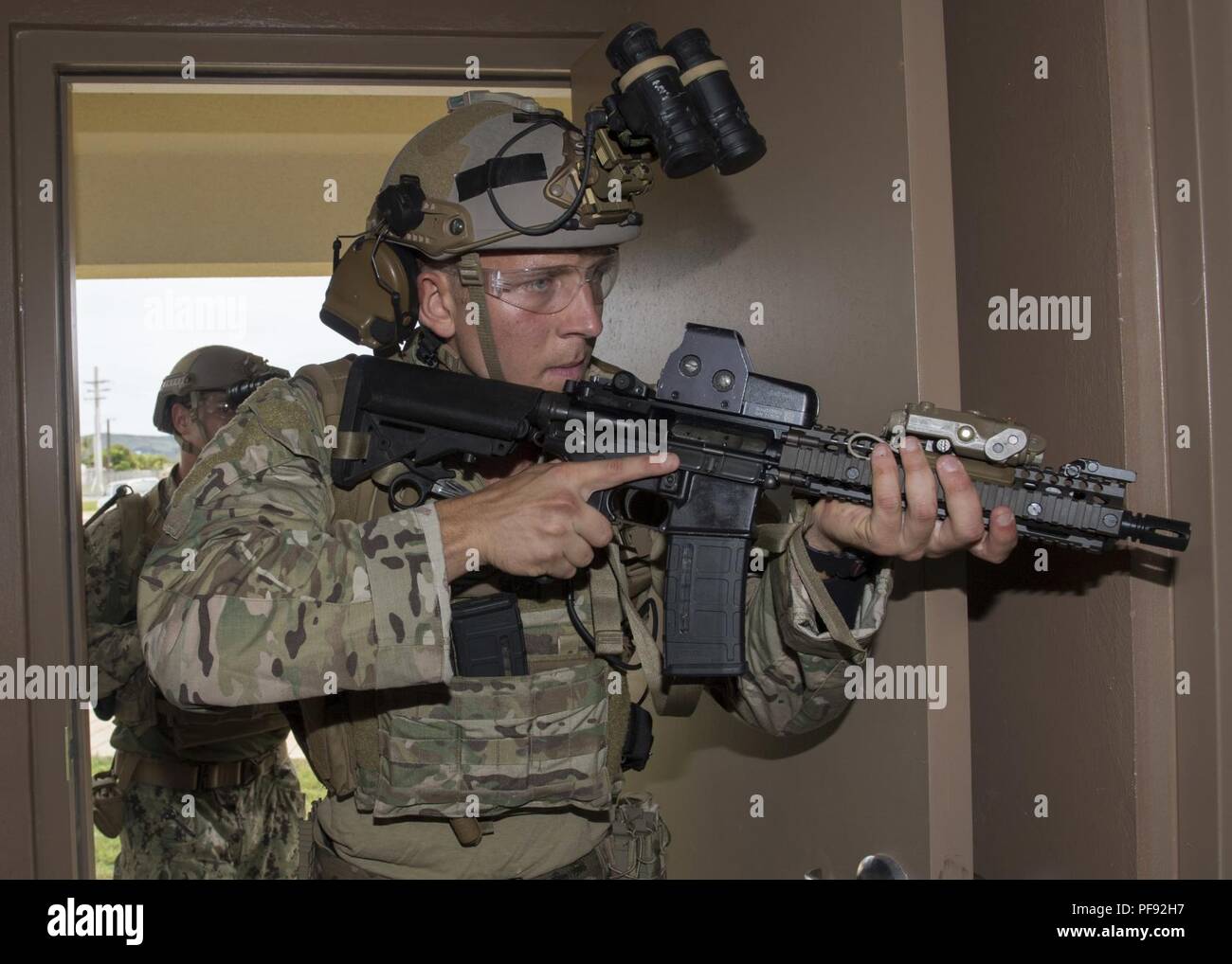 Ordnance Disposal Technician 2nd Class Shelby Clippard, front, from  Detroit, and Explosive Ordnance Disposal Technician 2nd Class John  Bergmann, back, from Nampa, Idaho, assigned to Explosive Ordnance Disposal  Mobile Unit (EODMU) 5,