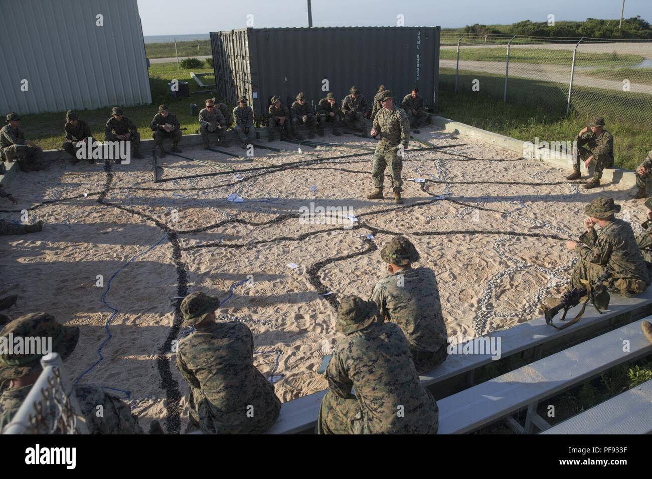 A platoon sergeant with 1st Battalion, 2nd Marines briefs his platoon ...
