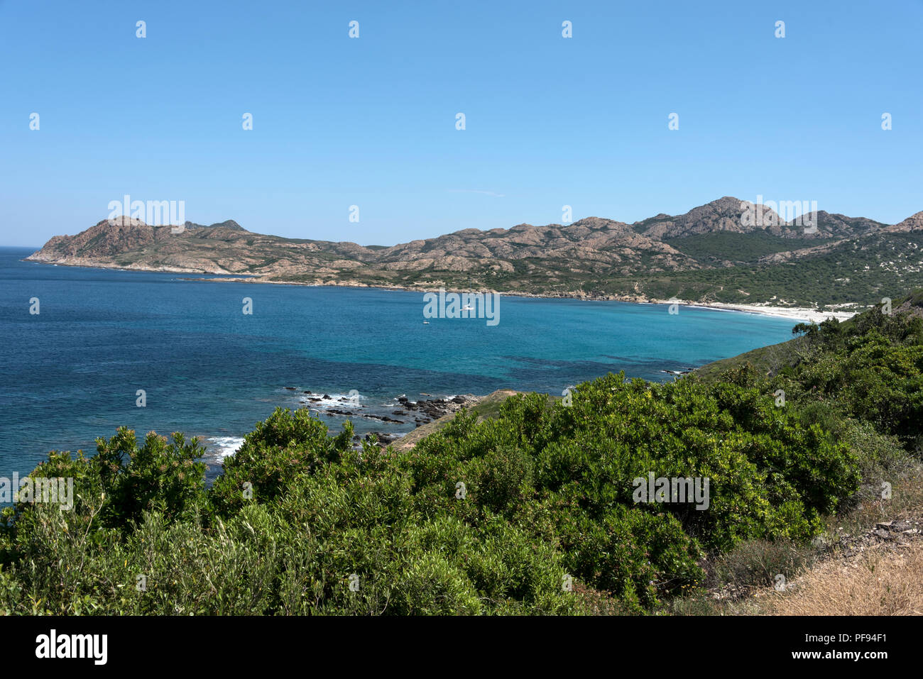Spiaggia dell'Ostriconi ,a large sweeping bay seen from  the scenic coastal road ( T30) towards  Ile-Rousse on the north -west coast of Corsica, Franc Stock Photo